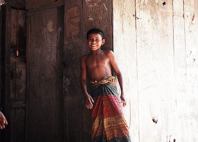 A Bengal boy wearing a lungi, a traditional dress.