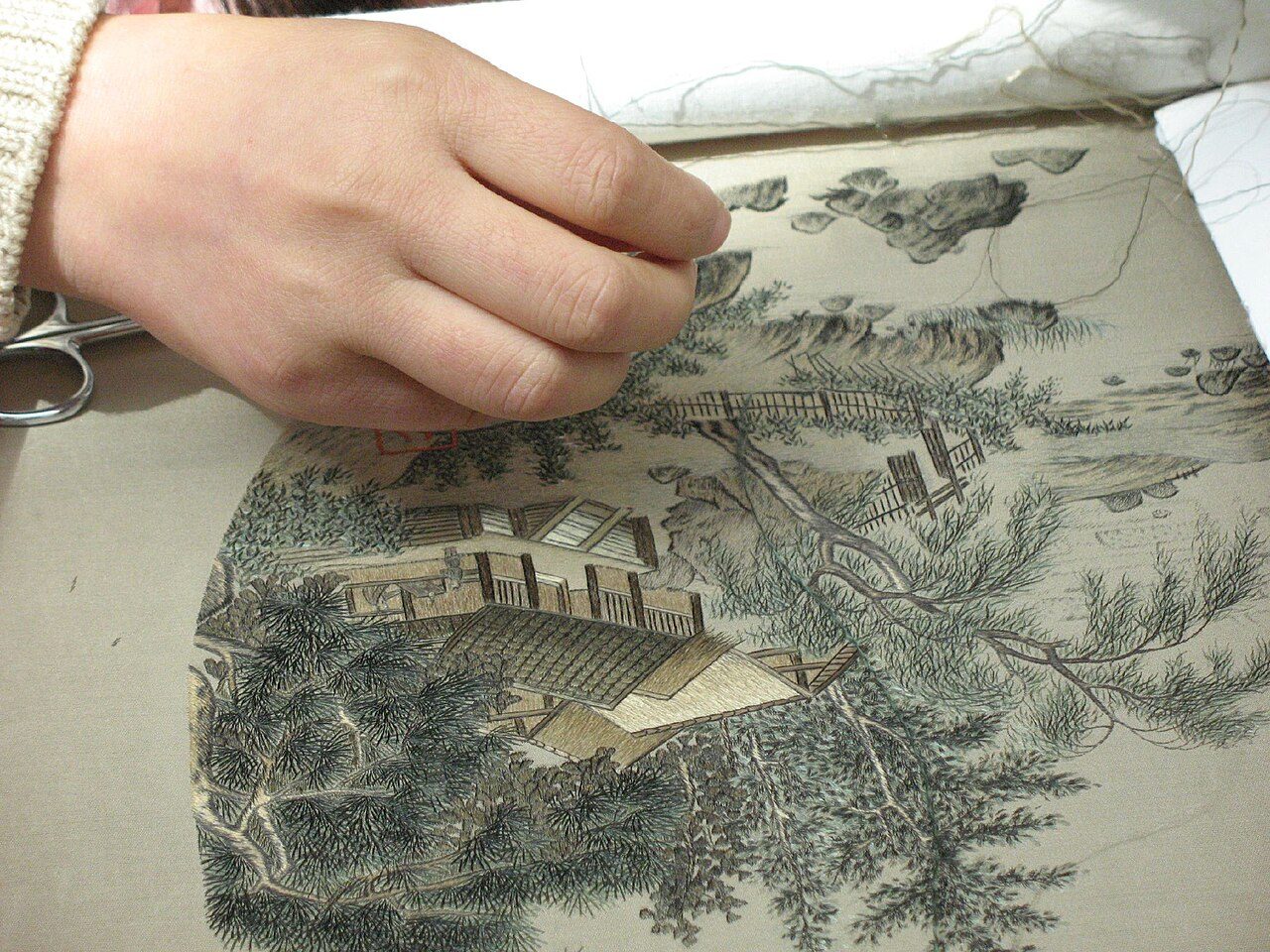 Gu Embroidery, which began with a Gu family in Suzhou, women recreate tradtional Chinese paintings in embroidery.