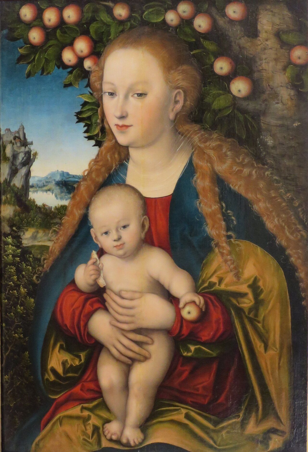 The Child Christ helds bread and apple in his hands. The apple is the symbol of the original sin, the bread (the body of Christ) of the redemption. The Virgin is considered to be the second Eve redempting the sin of the first.
