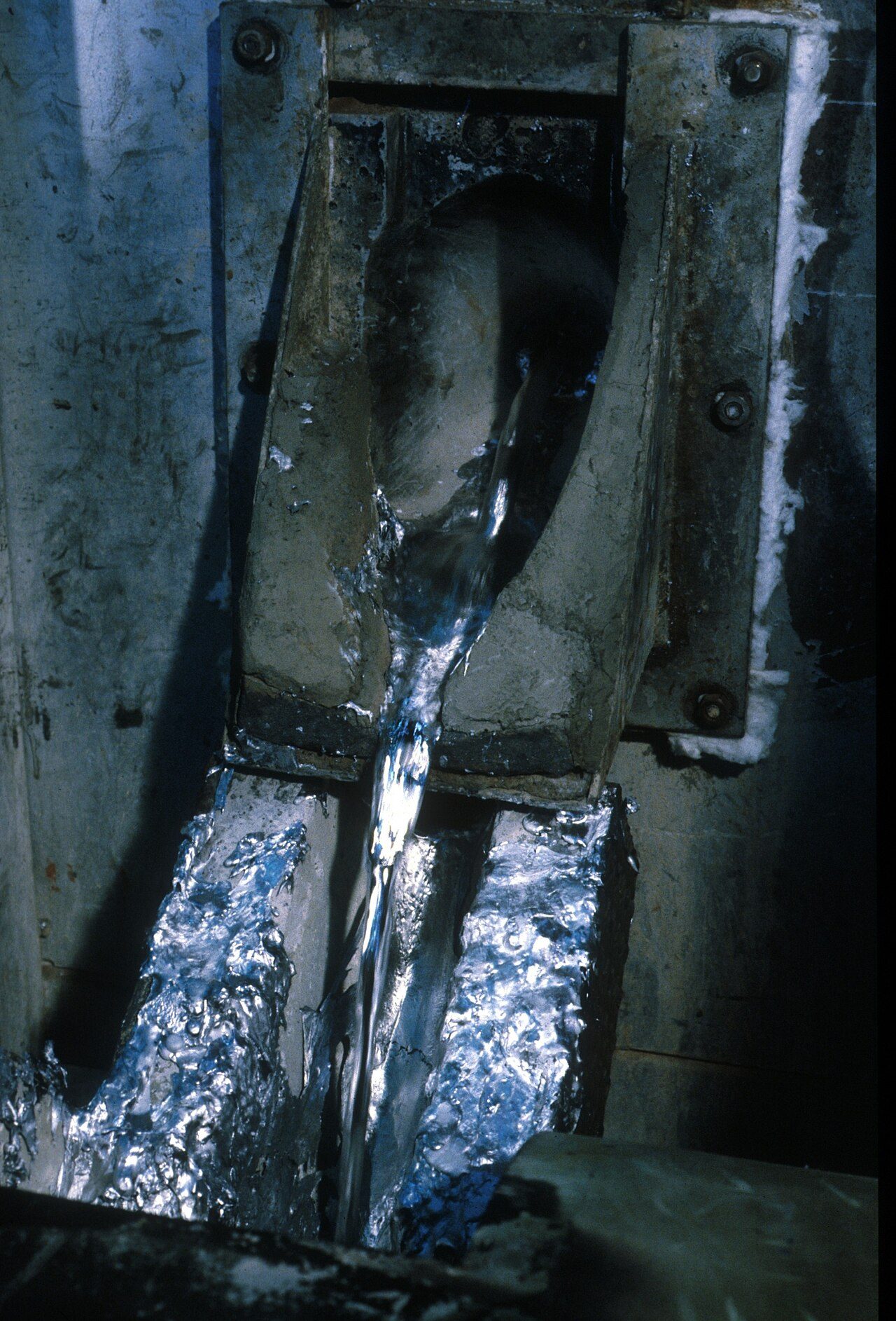 Molten metal (possibly zinc ) prior to casting.