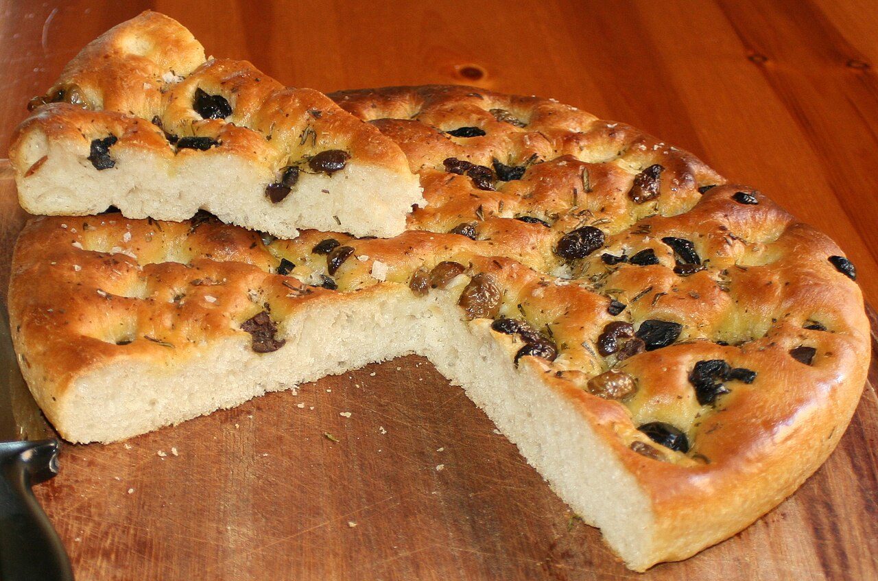 My homemade Focaccia with Olives , Rosemary and Sage .