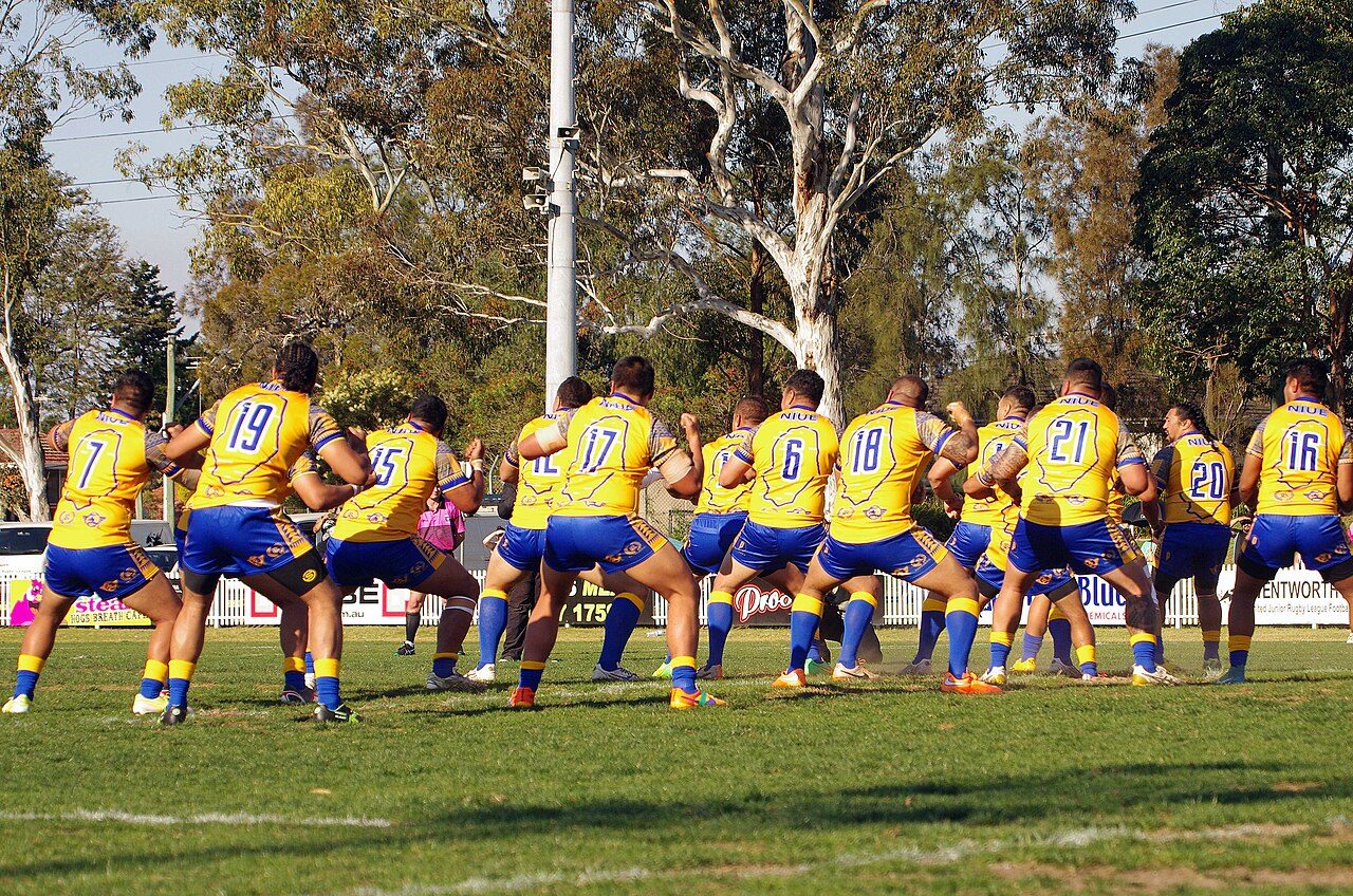 Niue national rugby league team performing it’s war cry, takalo, before a test match against the Cook Islands.
