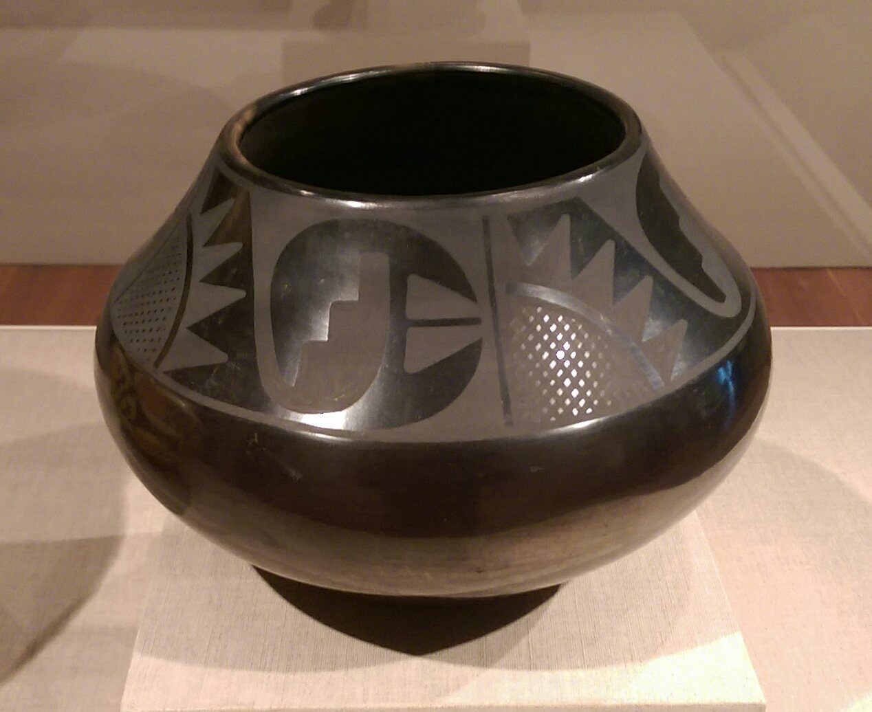 A pot by Native American artist Maria Martinez, approximately 1945, on display at the de Young Museum in San Francisco. Photo by Jim Heaphy.