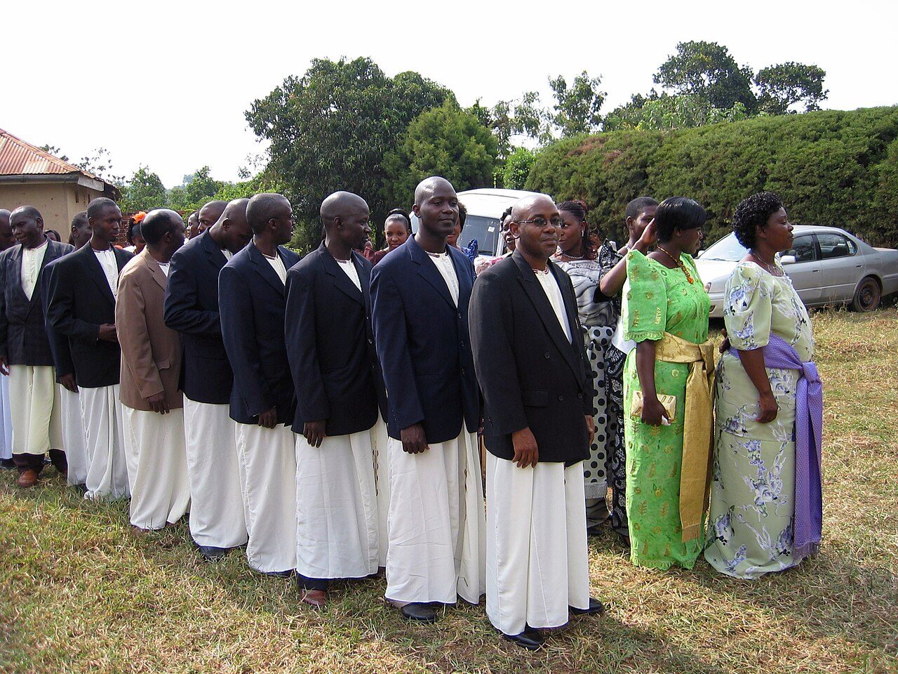 Members of the groom's clan line up in their kanzus at a wedding in Kampala, Uganda.