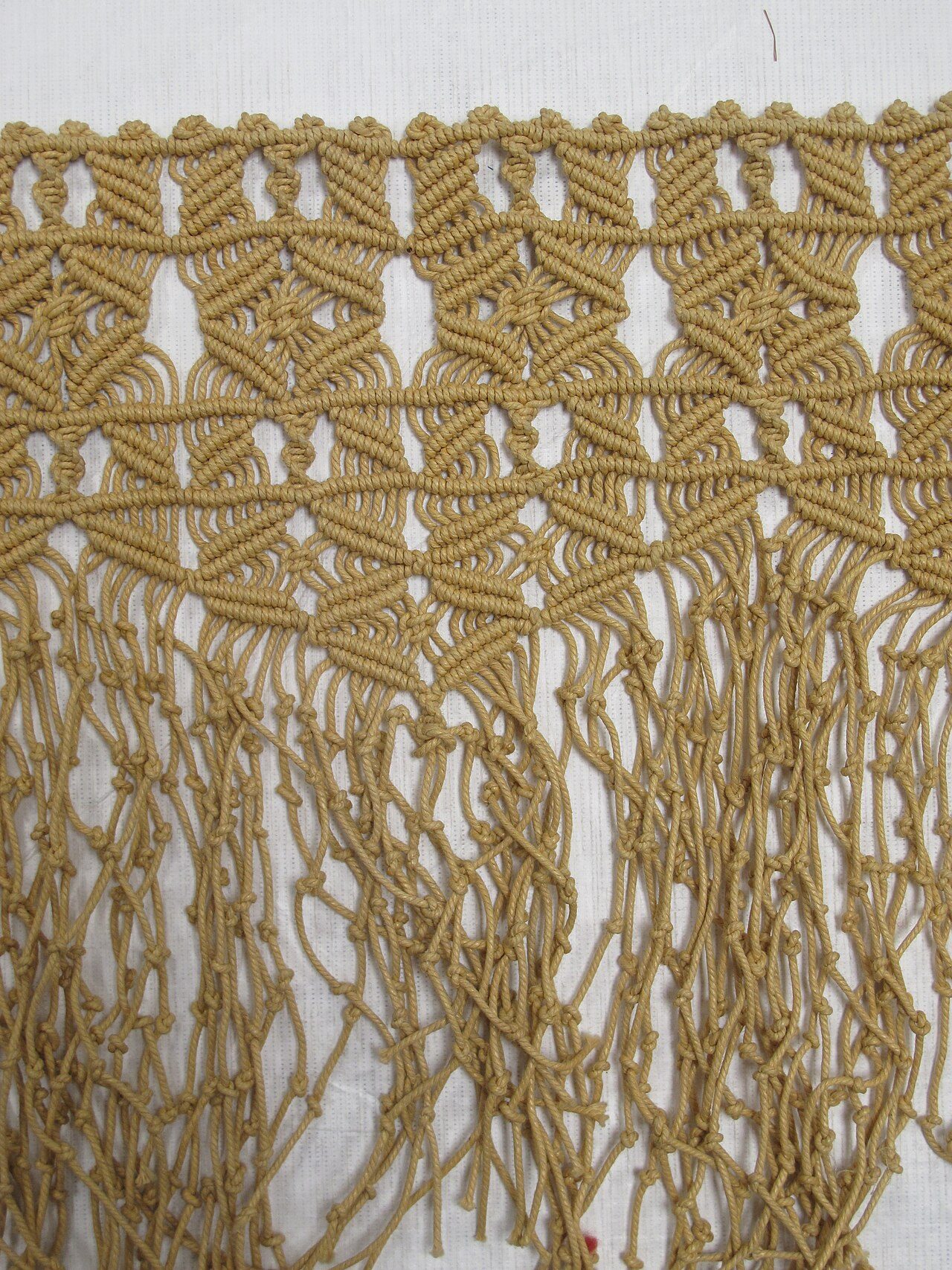 piece of macramé, unfinished