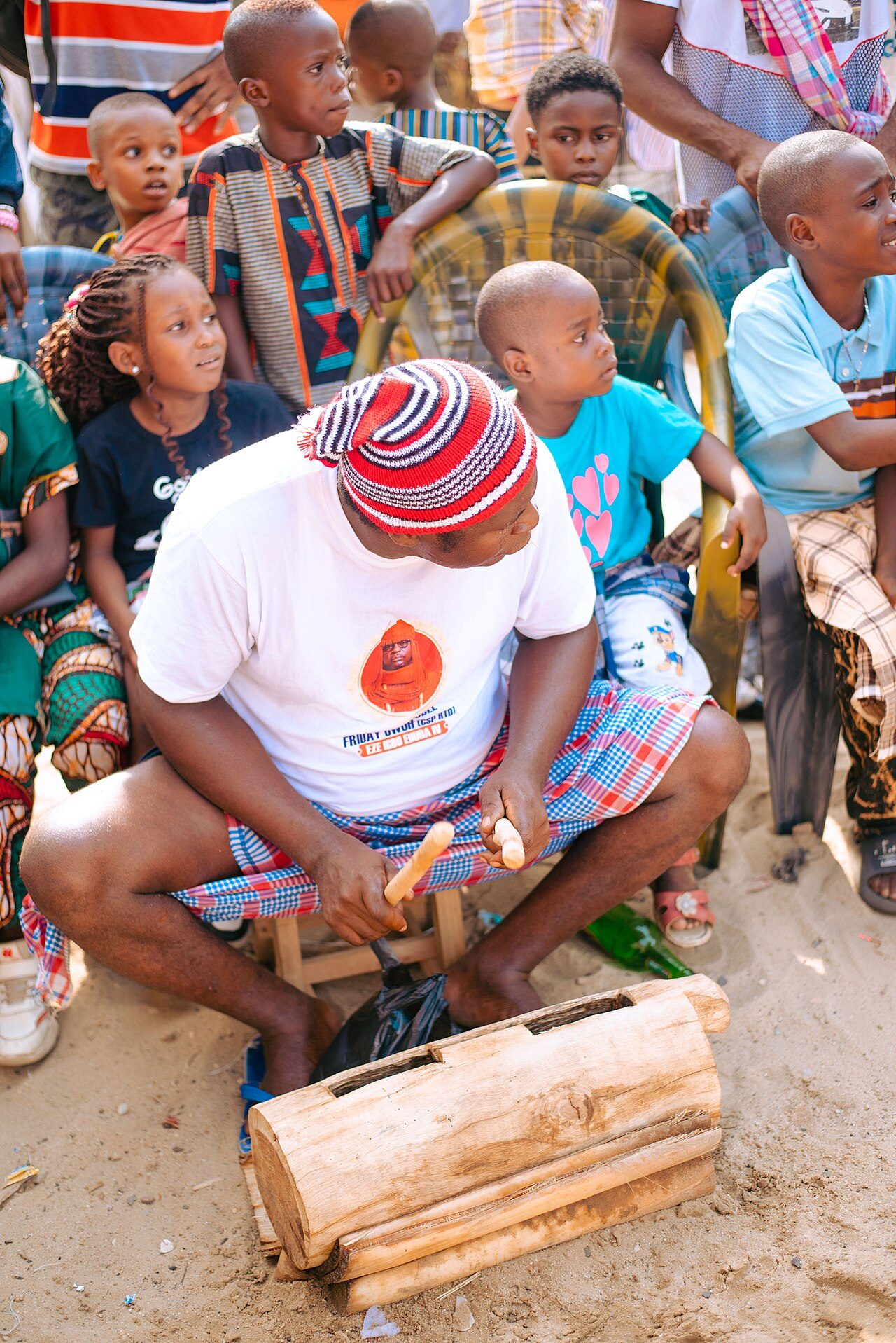 This photo depicts an Ekpeye drummer playing the Ekwe. The Ekwe drum is one of Ekpeye's tangible cultural heritage.