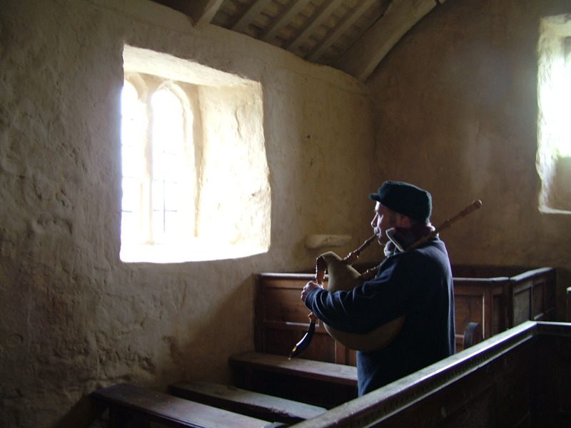 Ceri Rhys Matthews playing the Welsh Bagpipe in Llanfaglan Church