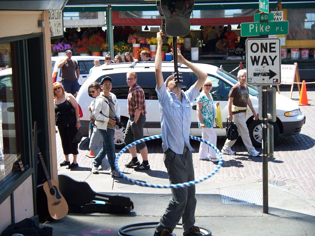 Balancing a guitar & hula hoop at the Pike Place market in Seattle