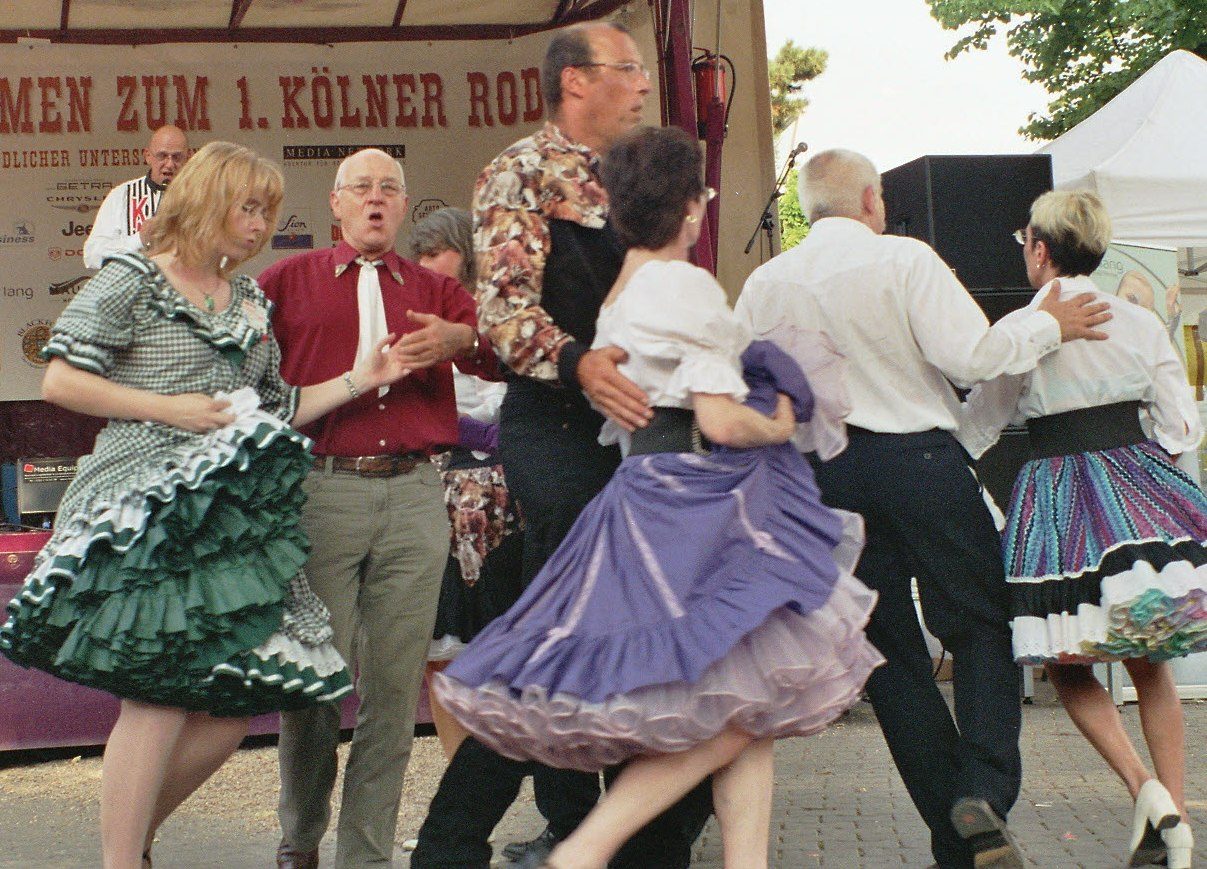 Western Square Dance Group. The women are wearing traditional layered net crinoline petticoats.