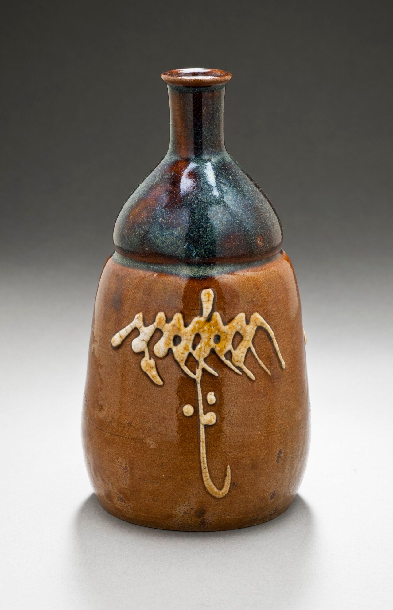 Japan, Edo period, late 18th-early 19th century Alternate Title: Tokkuri Furnishings; Accessories Koishiwara ware; stoneware with brown glaze and white slip Height: 7 1/4 in. (18.42 cm); Diameter: 4 in. (10.16 cm) Gift of James D. and Veronica H. Roorda (M.2007.226.8) Japanese…