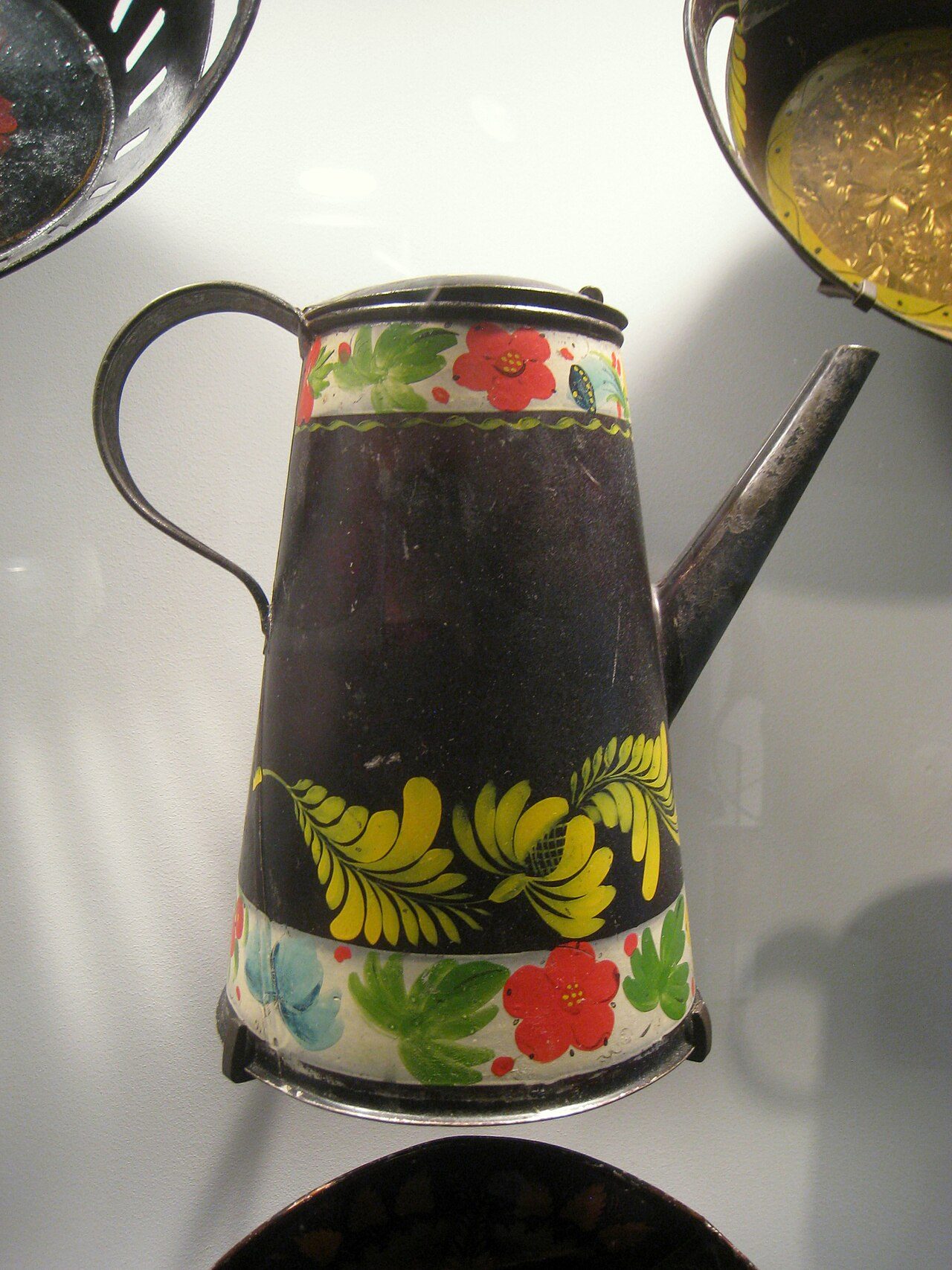 Coffee pot, circa 1815-1835, probably from Pennsylvania. Exhibited in the American Folk Art Museum , New York City, New York, USA. There were no restrictions on photography in the museum, and this item is old enough so that copyright (if any) has expired.