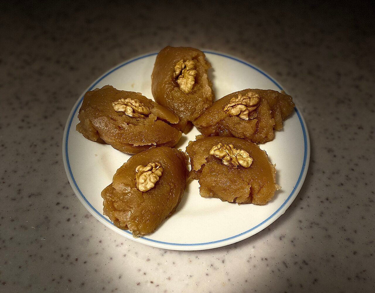 Halva is a thick paste made from flour, butter, liquid oil, and sweetened with sugar. Dry fruit are used for decor, but also as an ingredient.
