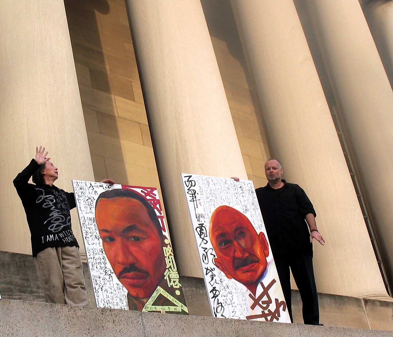 Huang Xiang and William Rock with their Century Mountain Project paintings Century Mountain of Martin Luther King and Gandhi.