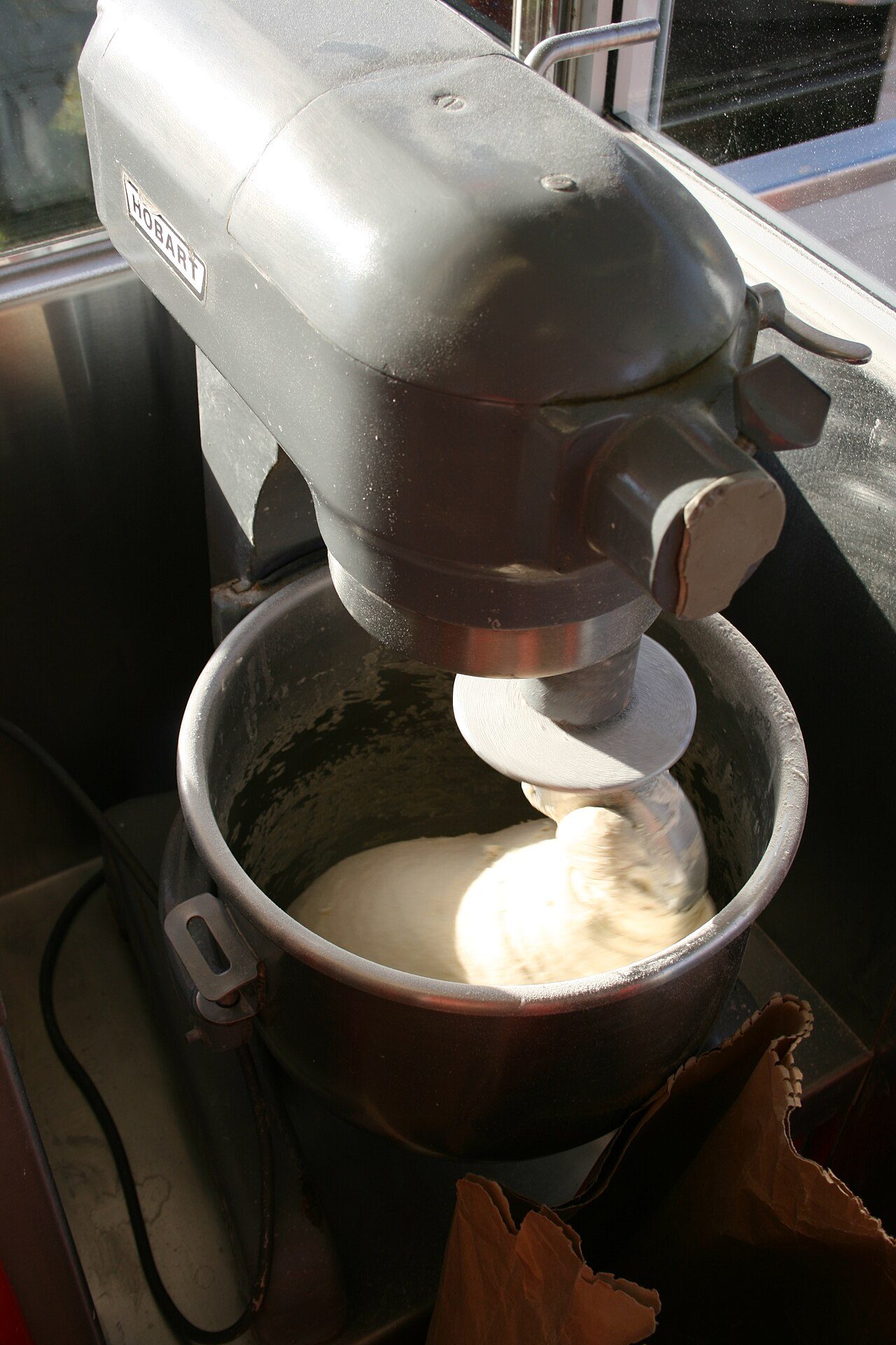 Mixing dough to be fried.