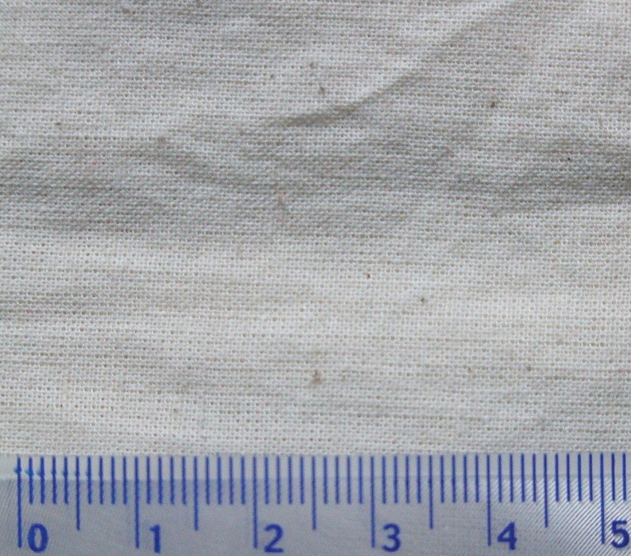 Calico used to fabicate a promotional shopping bag. Scale in cm.