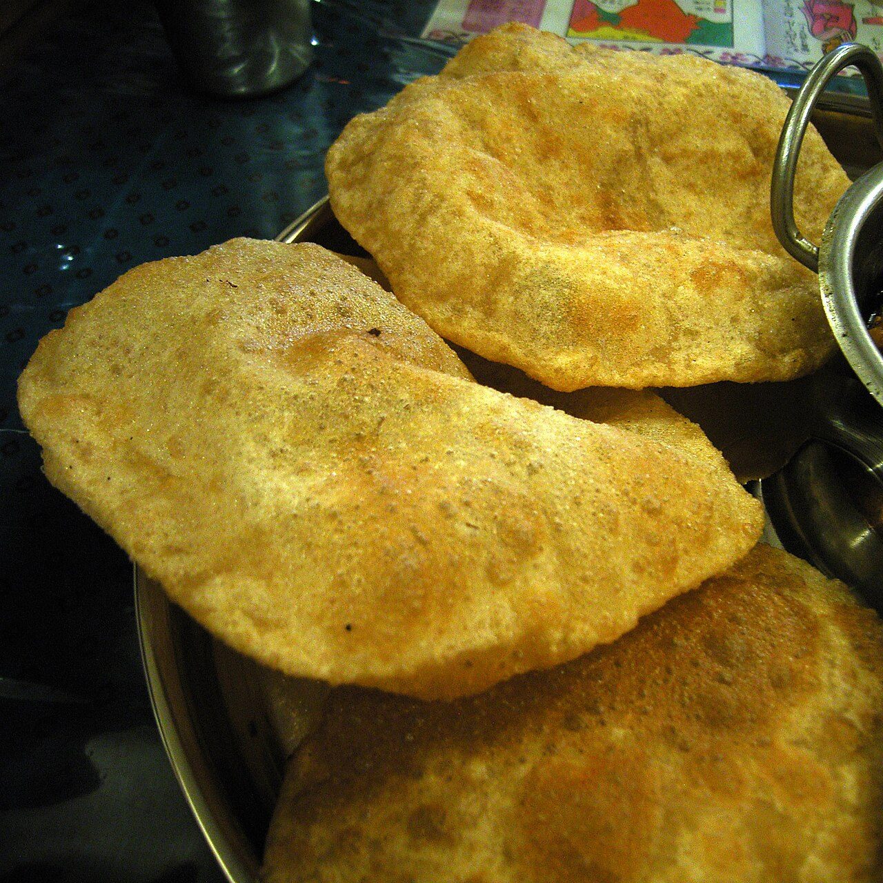 Puri de:Puri (Brot) , ta:பூரி (உணவு) A puri or poori is an Indian unleavened bread made from a dough of atta (whole grain durum wheat flour), water and salt by rolling it out into discs of approximately 12 cm diameter and deep frying it in ghee or vegetable oil.…