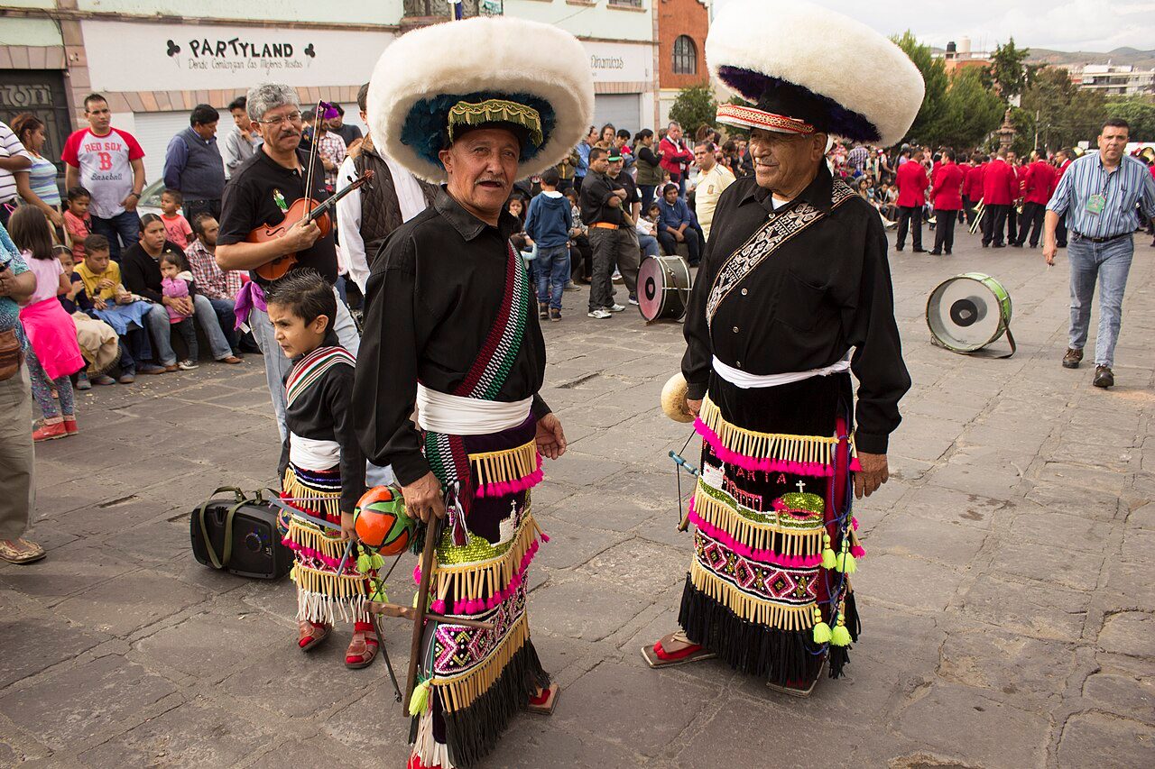 Mexican matachines from Zacatecas getting ready for a street performance at the World Folkloriada