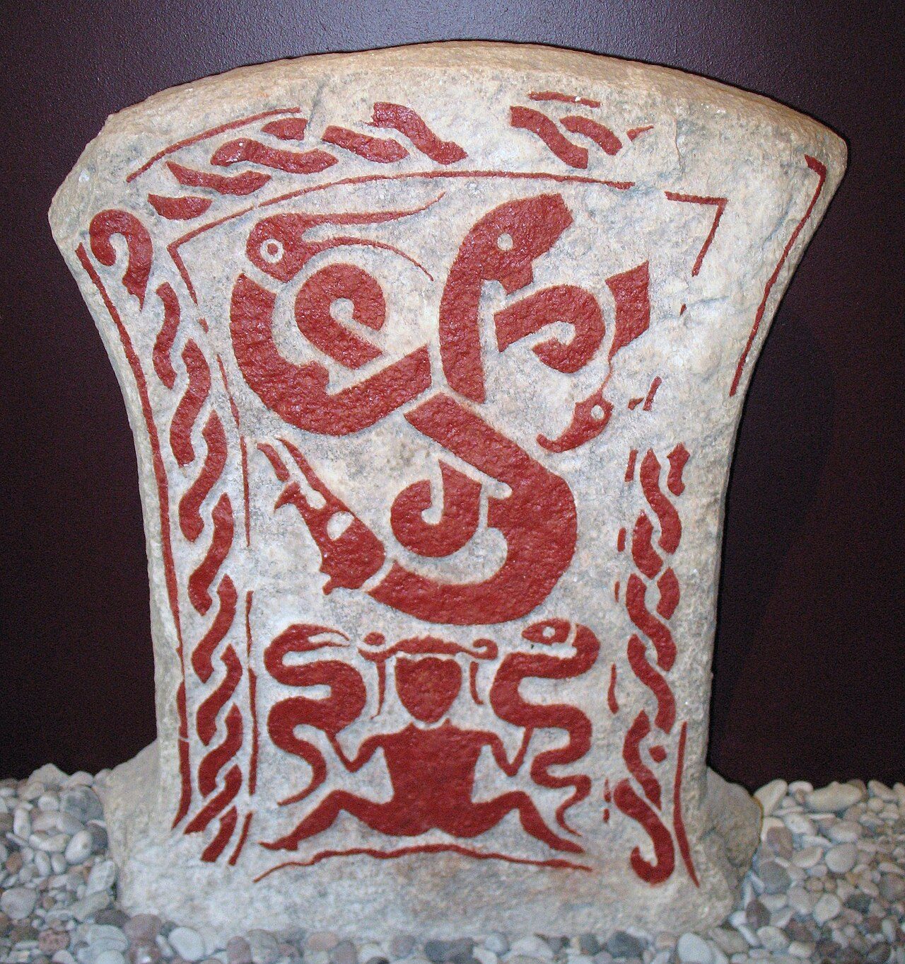 Vitastjerna's dream from the Gutasaga with the three entwined snakes symbolizing Graip, Gute and Gunfjaun, with her at the bottom, Gotland, Sweden. Now in Fornsalen museum, Visby.