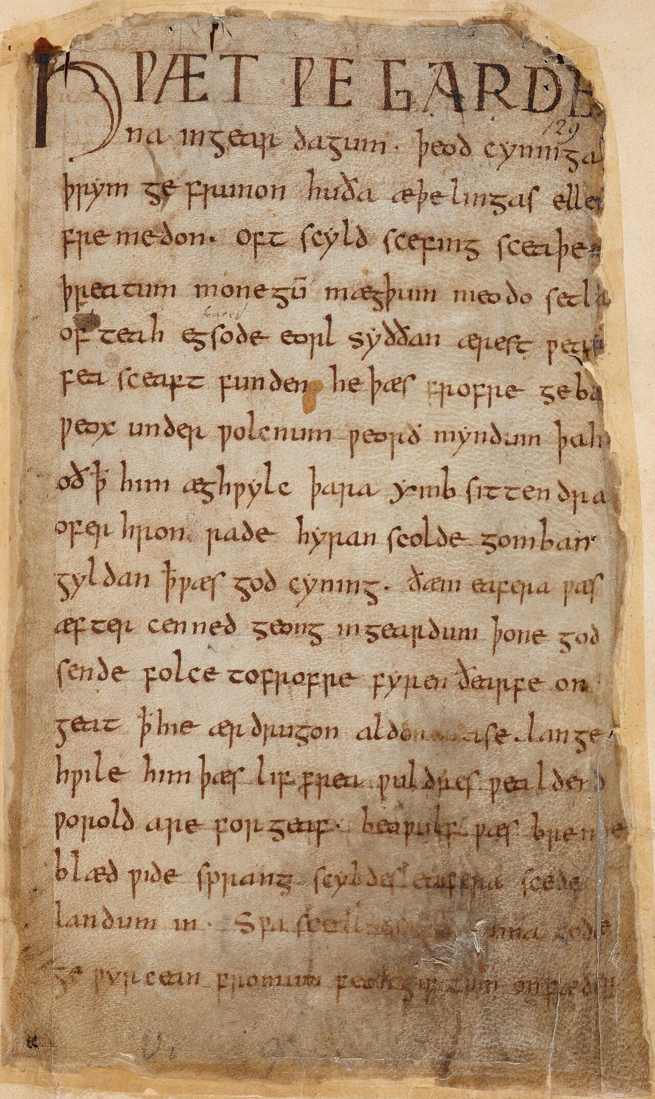 The first folio of the heroic epic poem Beowulf, written primarily in the West Saxon dialect of Old English. Part of the Cotton MS Vitellius A XV manuscript currently located within the British Library. This is a digital photographic copy of the folio. Text shown according to…