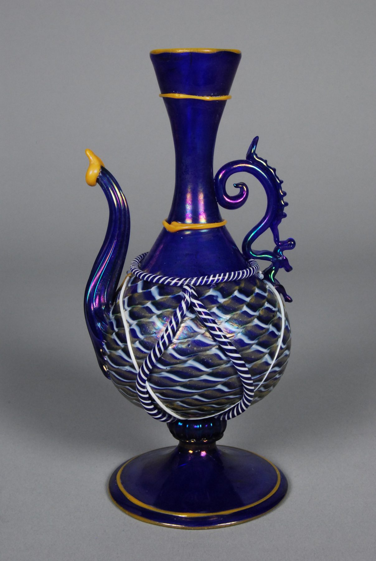 Salviati & Company produced faithful copies of ancient vessels, but the firm was also known for original fanciful designs. New creations, such as this ewer, combined the styles and techniques of ancient Egypt with forms associated with Renaissance Venice. In ancient Egypt,…