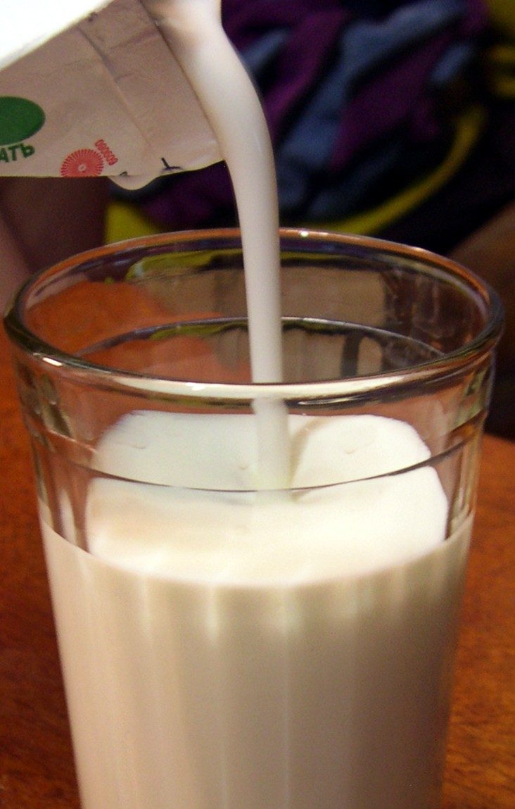 Kefir is pouring into the glass