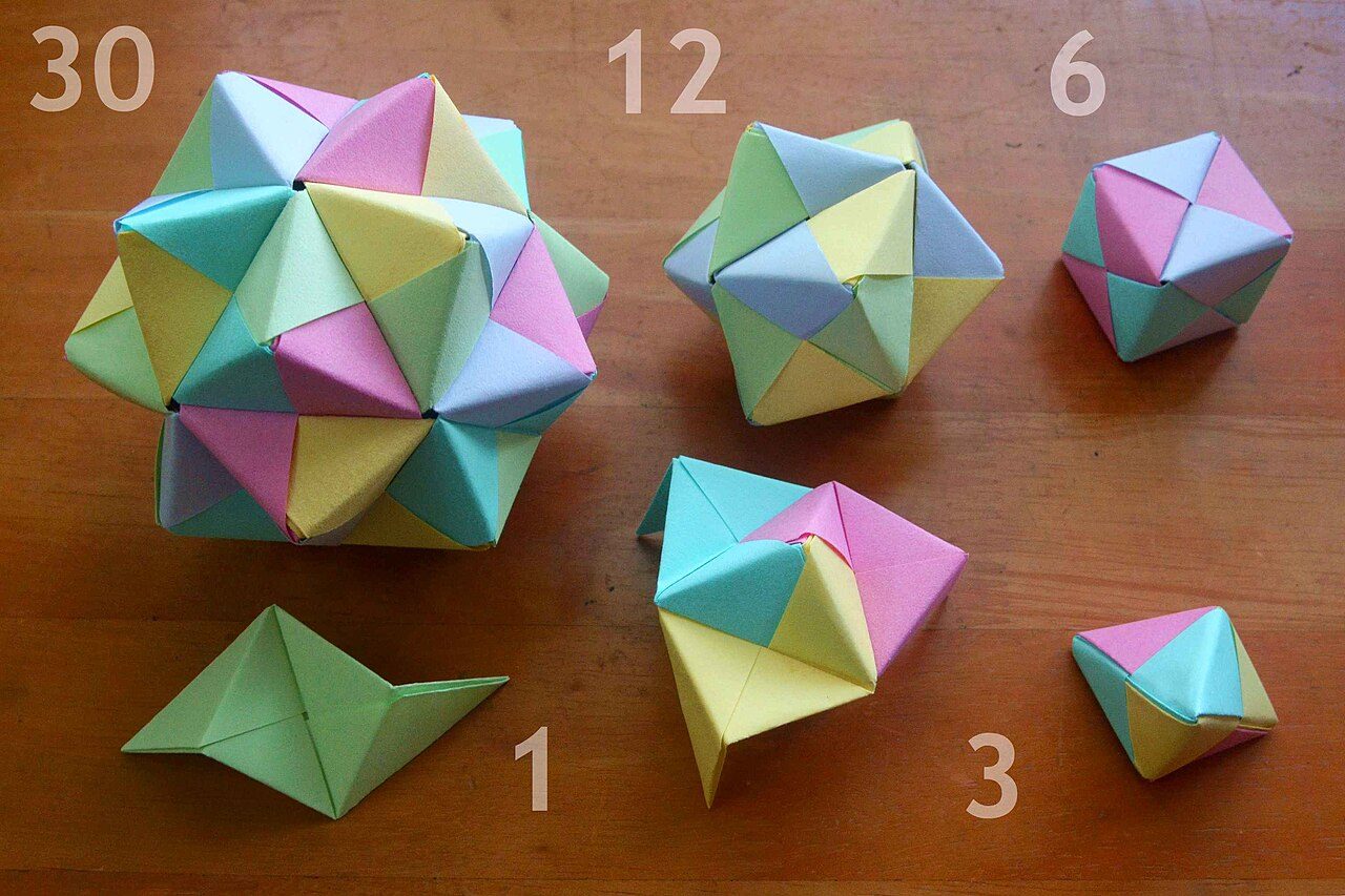 Anticlockwise from bottom left, numbers denoting module count: 1. One Sonobe module 3. Opened and completed Toshie's Jewel (triangular bipyramid) 6. Cube (triakis tetrahedron) 12. Triakis octahedron 30. Triakis icosahedron