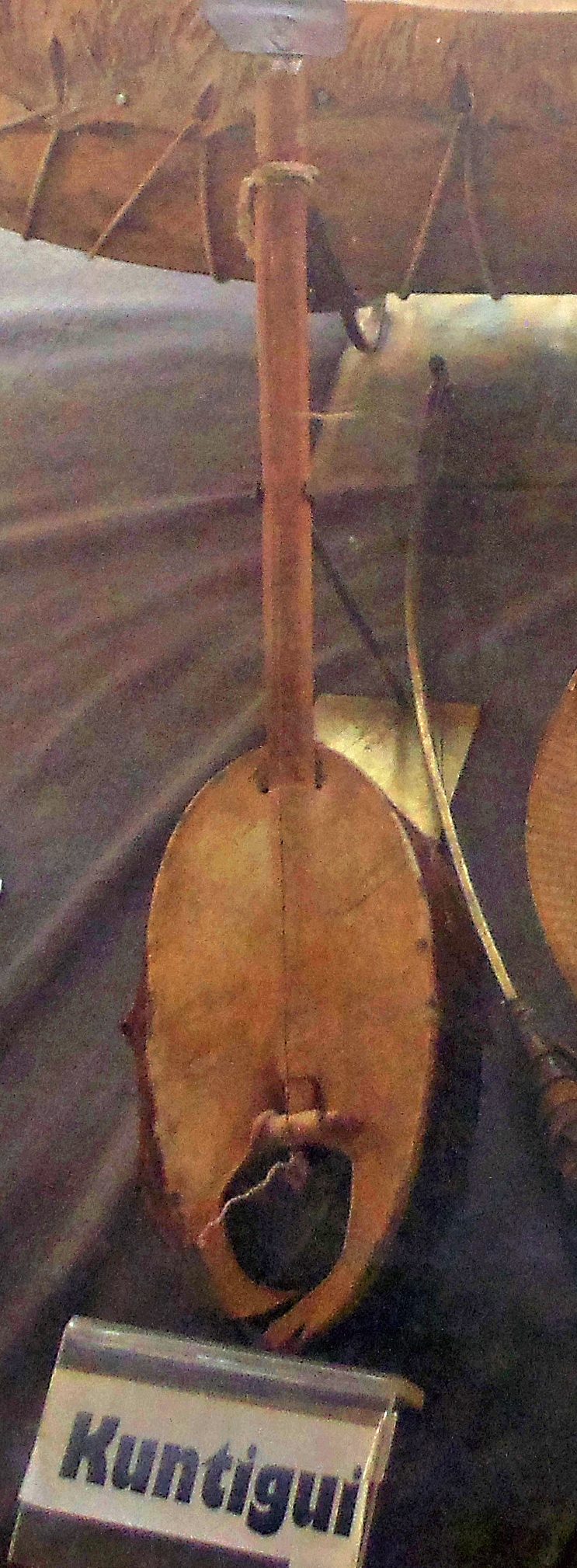 Picture of a kontigi, a one string African lute of the Hausa people. Soundbox made from oval-shaped sardine can.