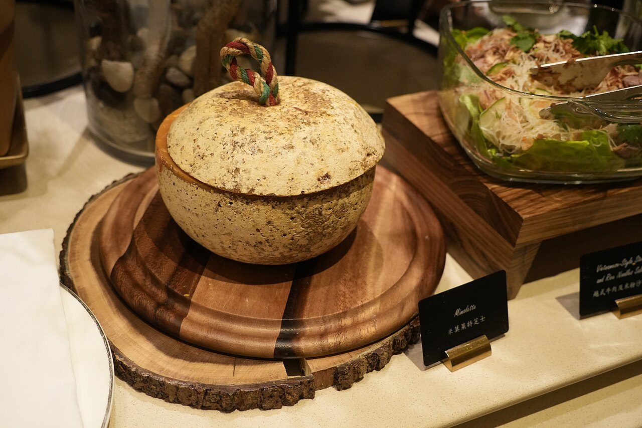 A Mimolette Cheese at the buffet table at The Verandah in The Peninsula Hong Kong in Tsim Sha Tsui, Kowloon, Hong Kong