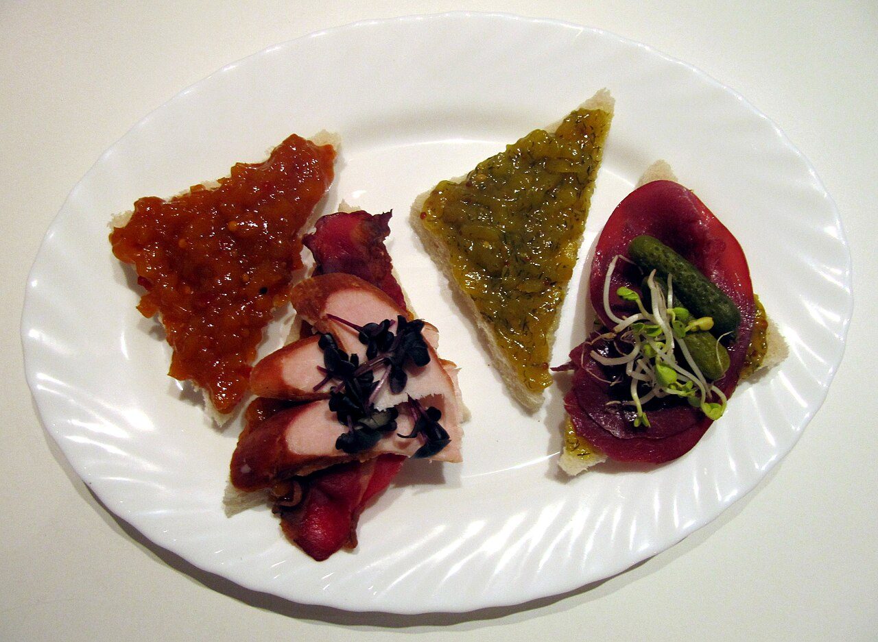 Two sandwiches with different relishes