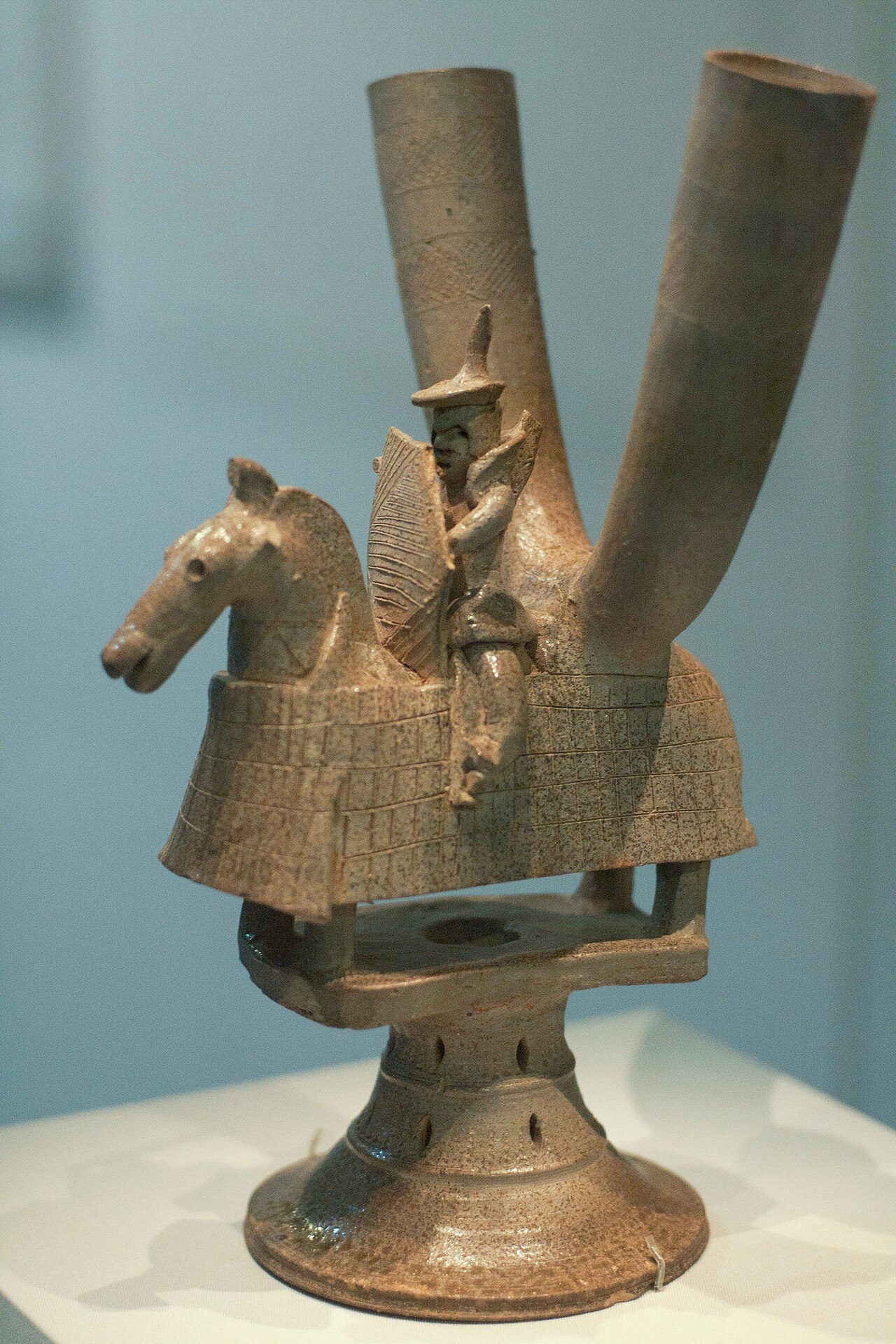 Ceremonial stoneware vessel, double wine cup in the shape of a mounted warrior from Gaya federation (42-562), a group of statelets which existed during the Three Kingdoms period in southern Korea. Stone ware with ash glaze figurine, 5th-6th century, reportedly from Tôksan-ni,…