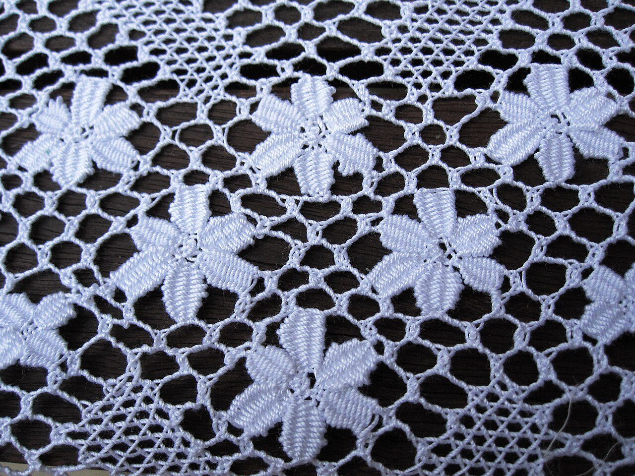 Bobbin lace from Moca, Puerto Rico. Detail with Bellis perennis.
