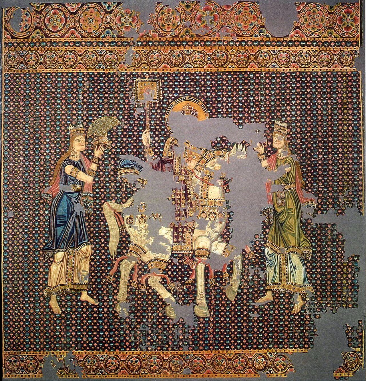 The so-called " Bamberger Gunthertuch ", a Byzantine silk tapestry depicting a Byzantine emperor on his triumphant return from a campaign. He is crowned, bears the labarum and rides a white horse. Originally identified as Basil II (by A. Grabar), it is now accepted that he…