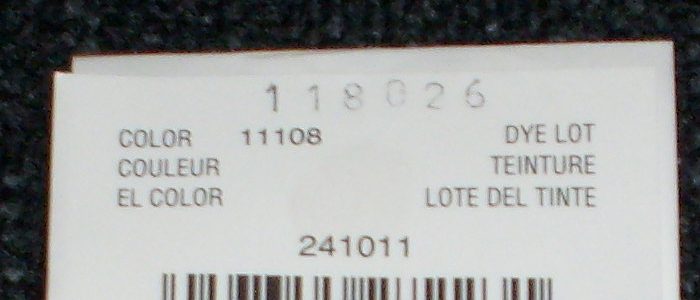 Dye lot markings on a yarn label, cropped to exclude brand information. For use as descriptive illustration of the dye lot concept. Dye lot is an important concept to to knitting and crochet.