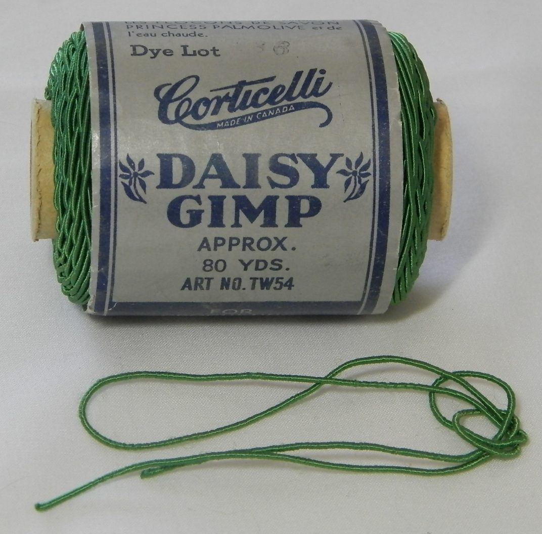 Spool of Corticelli Daisy Gimp. Probably "Shamrock Green".