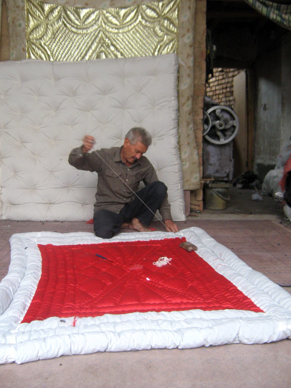 Quilter and quilting in the Bazaar of Nishapur