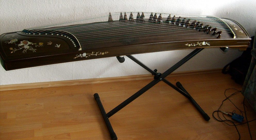 This is a Mongolian Yatga. This instrument has a length of 63" or 1.62 m. The instrument is very similar to the Chinese Guzheng and is related to the Korean Kayegum, Japanese Koto and Vietnamese Dan Tranh.