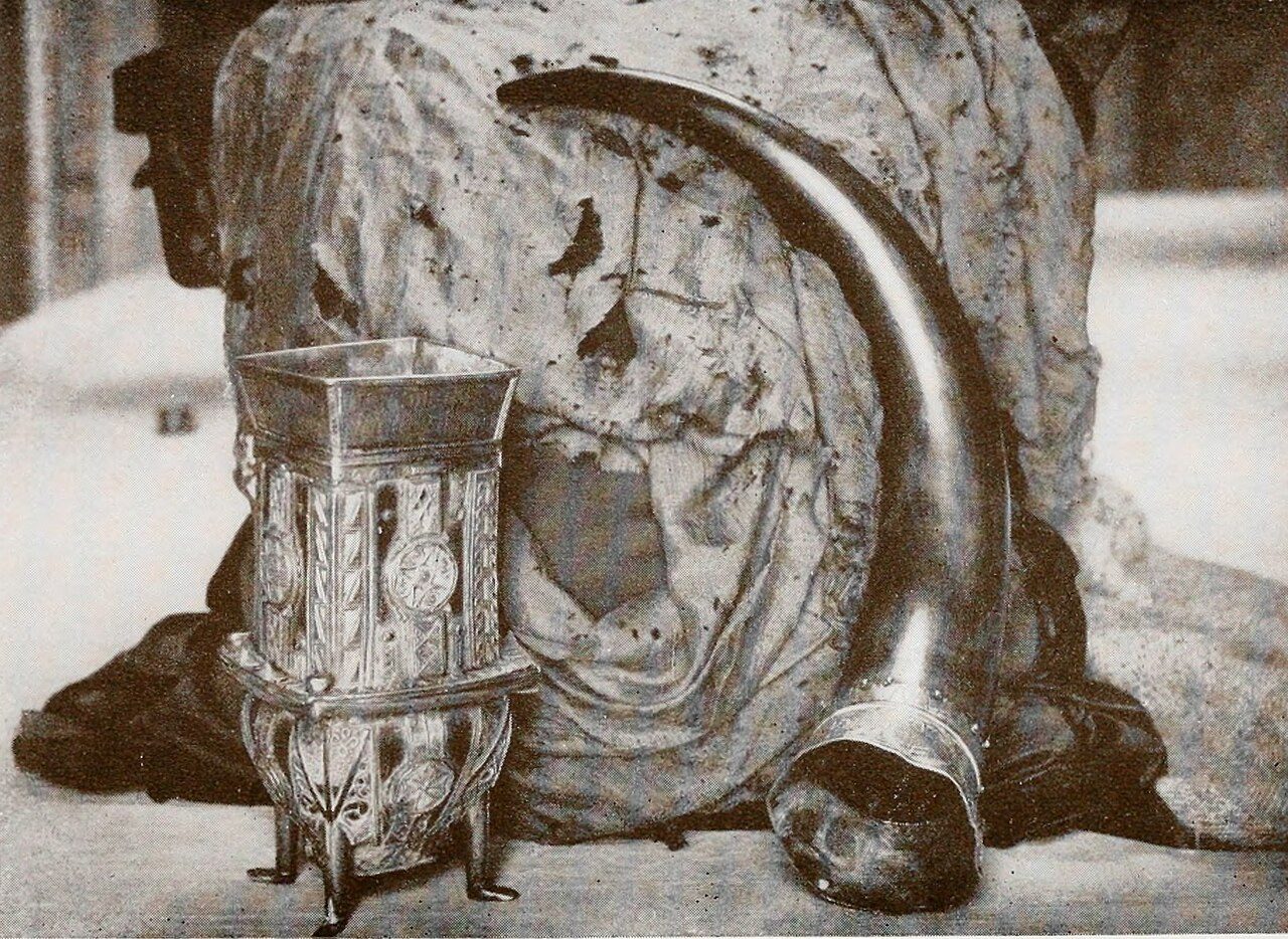 A photo of the Dunvegan Cup , Fairy Flag , and Rory Mor's Horn . This image is a cropped version of the photo which appears between pages 38-39, in the book The Macleods of Dunvegan from the time of Leod to the End of the Seventeenth Century . The photo is credited to Roderick…