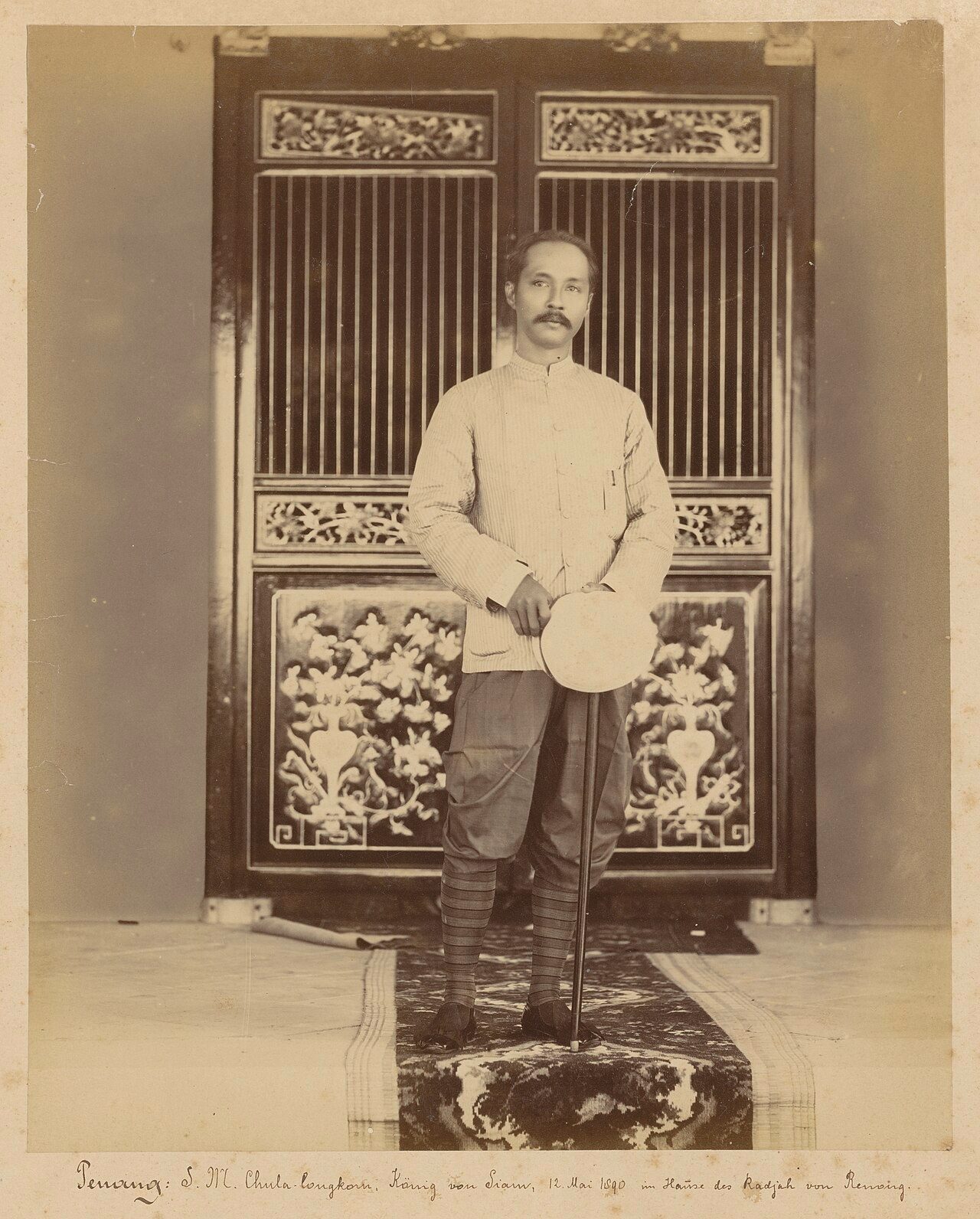 King Chulalongkorn wears the Raj Pattern costume, 1890. This photograph is taken by the German photographer August E. Kaulfuss (1861-1908). Kaulfuss worked and lived in Penang, Malaysia. The Raj Pattern (Ratcha Pataen, ราชปะแตน) is a folk costume of Thailand. The original royal…