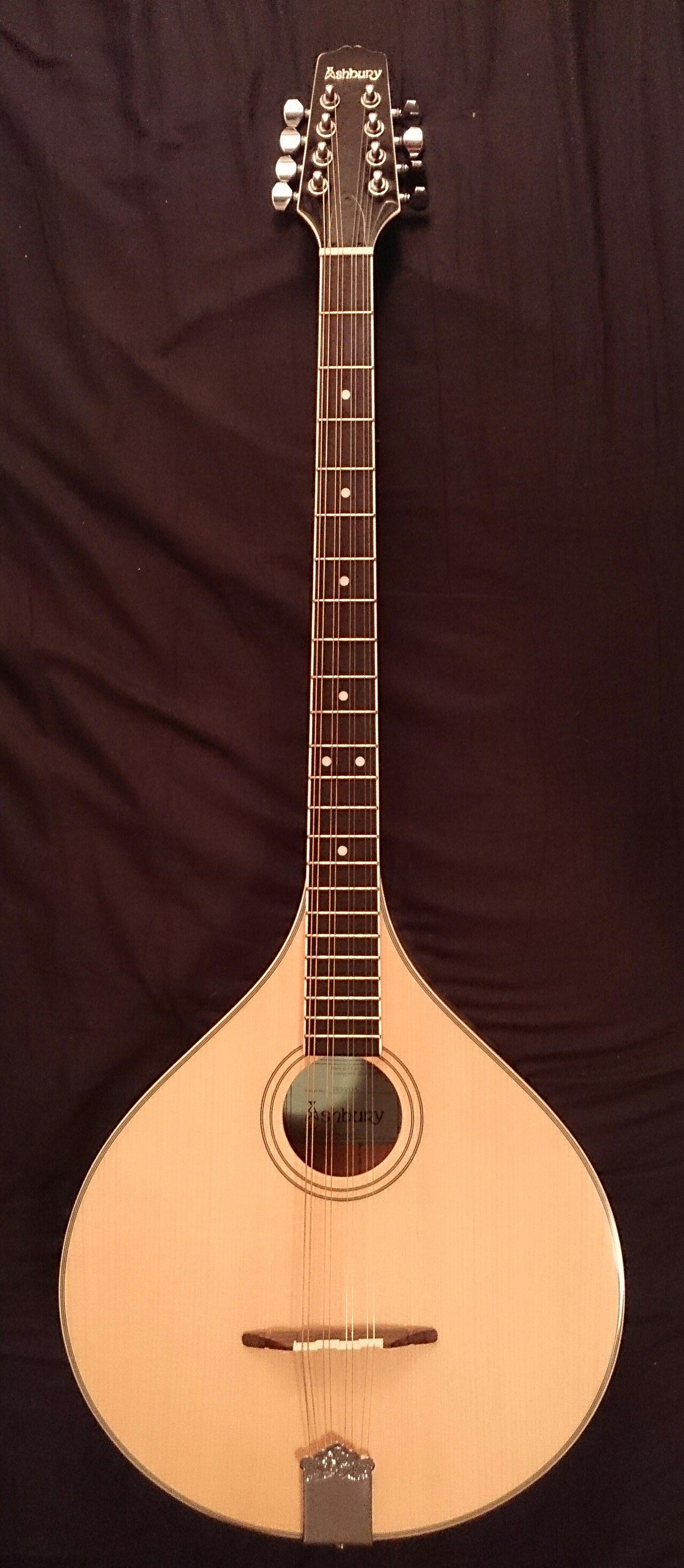 An Irish Bouzouki seen from the front with spruce top, maple body and neck and rosewood fingerboard. The overall body length is 953mm, the body width 343mm and the scale length 670mm. The instrument is manufactured by Ashbury.