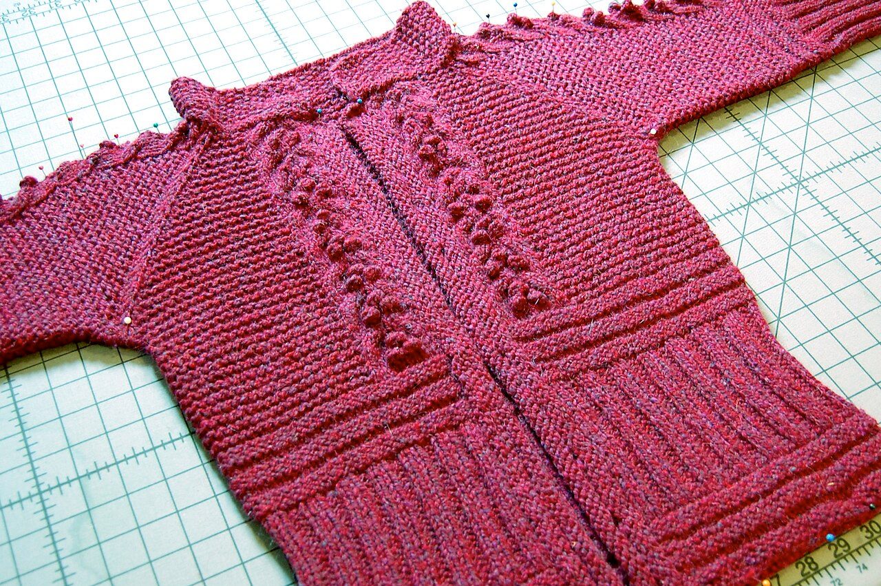 Bobbles and welting on the front of a hand-knitted jacket