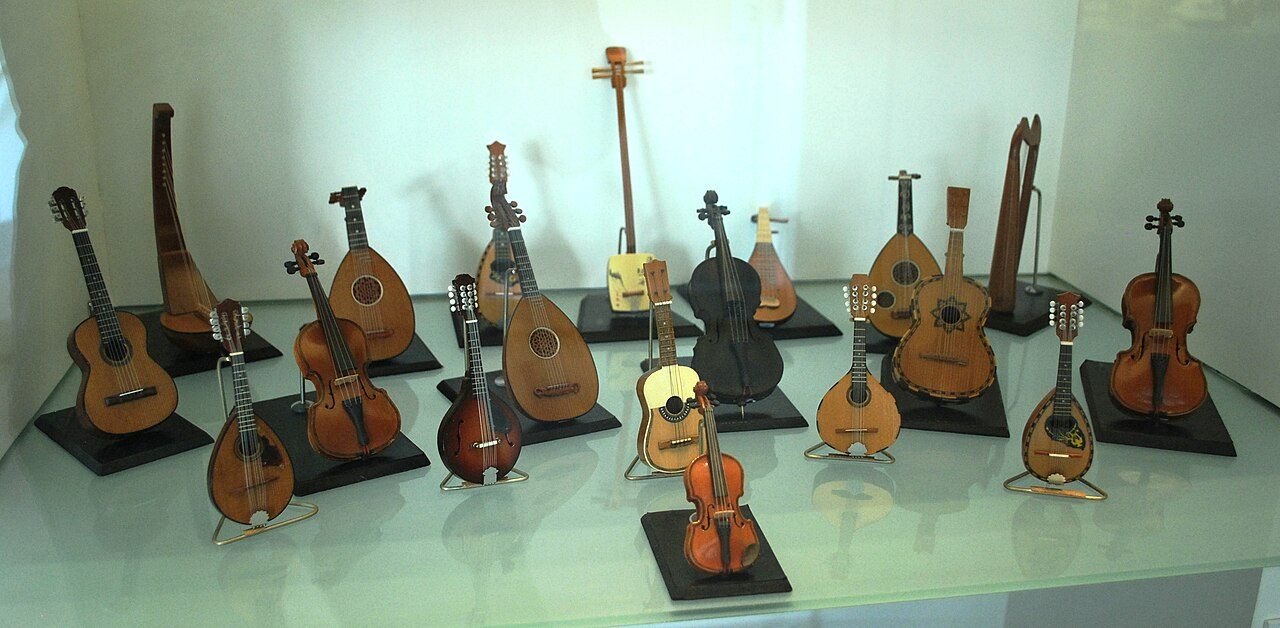 Display of folk string instruments such as guitars and violins at the Museum of Artes Populares in Mexico City