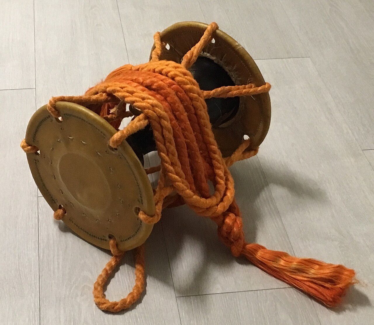 Japanese hourglass drum. Slightly larger than the Kotsuzumi. The long strands of rope complete with tassels, draped onto the drum, serves as a decoration. The drumhead is showing signs of wear, but still good for another five or so sessions, I believe. This drum does not produce…