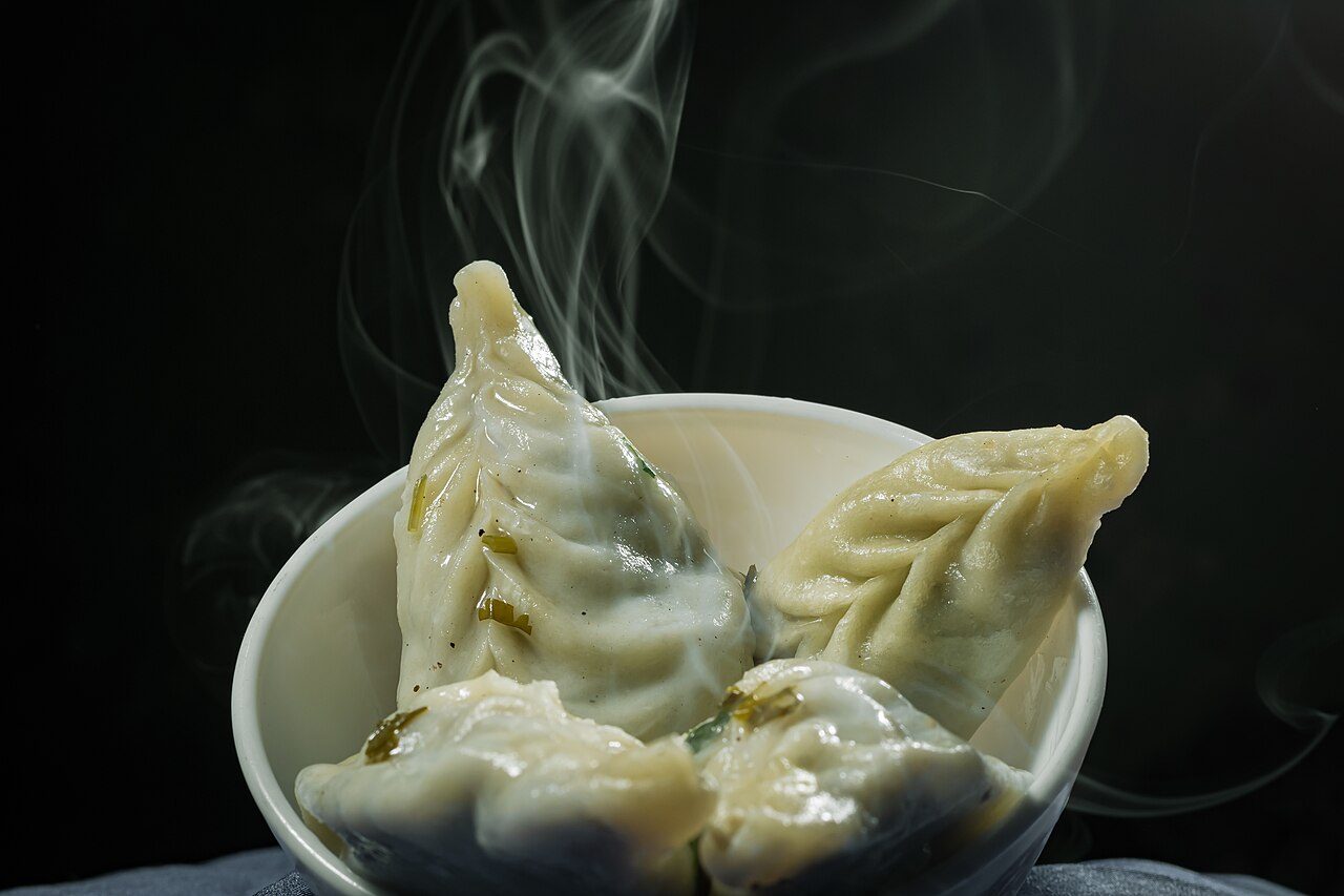 Veg Momo, a steamed or fried dumpling stuffed with mixed vegetables, is a delicious snack food enjoyed in Tibet region. From last few years, Momo are getting very popular in other parts of India and you can easily prepare them at home by either steaming or deep frying.